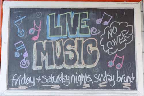 A chalkboard with 'Live Music' written in chalk